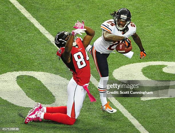 Tim Jennings of the Chicago Bears breaks up a pass intended for Roddy White of the Atlanta Falcons at the Georgia Dome on October 12, 2014 in...