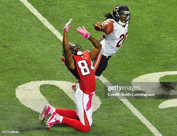 Tim Jennings of the Chicago Bears breaks up a pass intended for Roddy White of the Atlanta Falcons at the Georgia Dome on October 12, 2014 in...