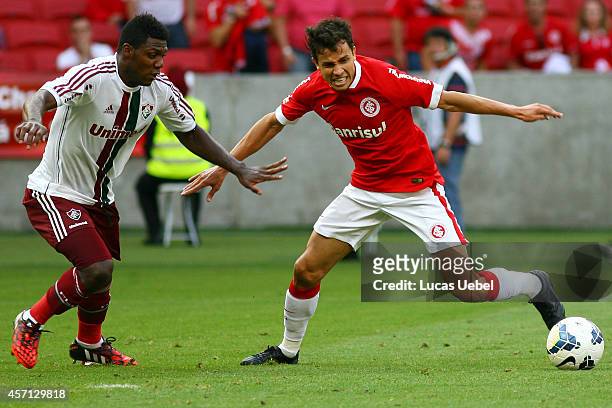 Nilmar of Internacional battles for the ball against Elivelton of Fluminense during the match between Internacional and Fluminense as part of...