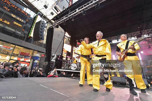 Members of the band Devo Gerald Casale, Mark Mothersbaugh, Bob Mothersbaugh performs during CBGB Music & Film Festival 2014 - Times Square Concerts...