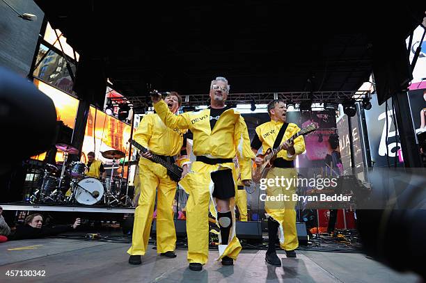 Members of the band Devo Gerald Casale, Mark Mothersbaugh, Bob Mothersbaugh perform during CBGB Music & Film Festival 2014 - Times Square Concerts on...