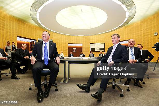 Prime Minister John Key and Finance Minister Bill English look on during the National Party's first cabinet meeting at The Beehive on October 13,...