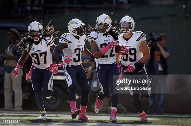 Jason Verrett of the San Diego Chargers is congratulated by Jahleel Addae, Richard Marshall and Andrew Gachkar after he after he intercepted a pass...