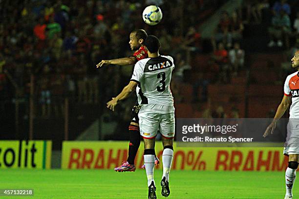 Ananias of Sport Recife wins a header with Roger of Vitoria during the Brasileirao Series A 2014 match between Sport Recife and Vitoria at Ilha do...