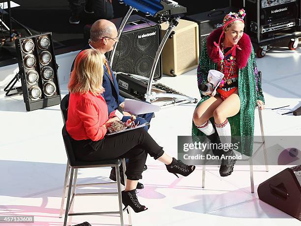 Miley Cyrus is interviewed by Sam Armytage and David Koch during the Sunrise show at Sydney Opera House on October 13, 2014 in Sydney, Australia.