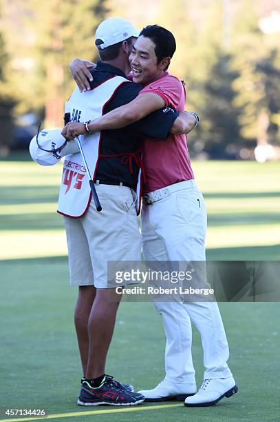 Sang-Moon Bae of South Korea hugs his caddy on the 18th green after winning the Frys.com Open at Silverado Resort and Spa on October 12, 2014 in...