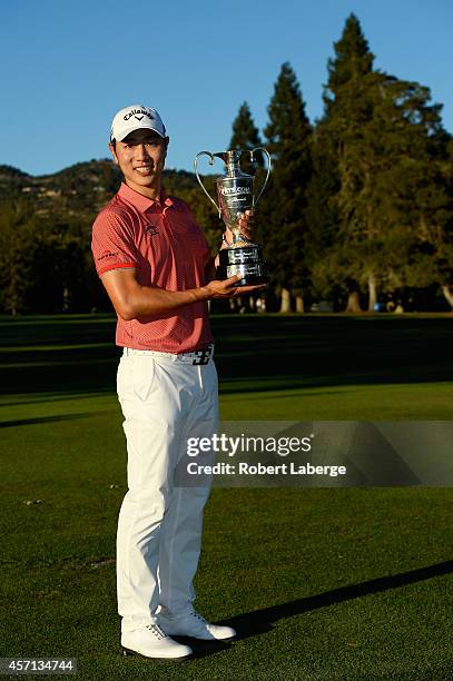 Sang-Moon Bae of South Korea holds the champions trophy after winning the Frys.com Open at Silverado Resort and Spa on October 12, 2014 in Napa,...