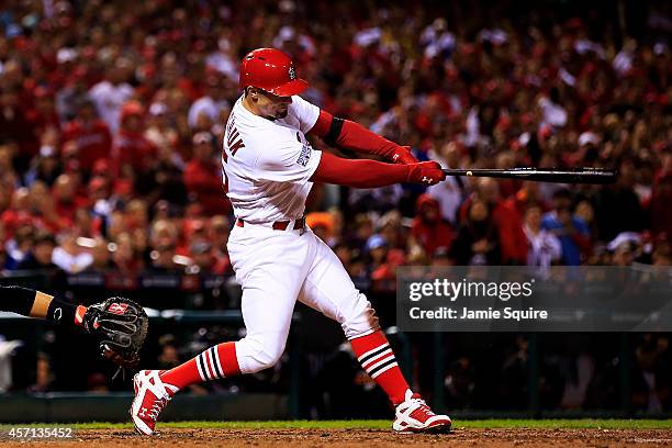 Randal Grichuk of the St. Louis Cardinals hits an RBI single scoring Matt Adams in the fourth inning against the San Francisco Giants during Game Two...