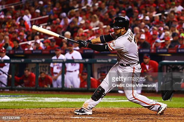 Gregor Blanco of the San Francisco Giants hits an RBI single scoring Brandon Crawford in the seventh inning against the St. Louis Cardinals during...