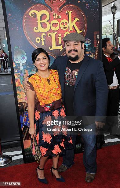 Director Jorge R. Gutierrez and wife arrive for the Premiere Of Twentieth Century Fox And Reel FX Animation Studios' "The Book Of Life" held at Regal...