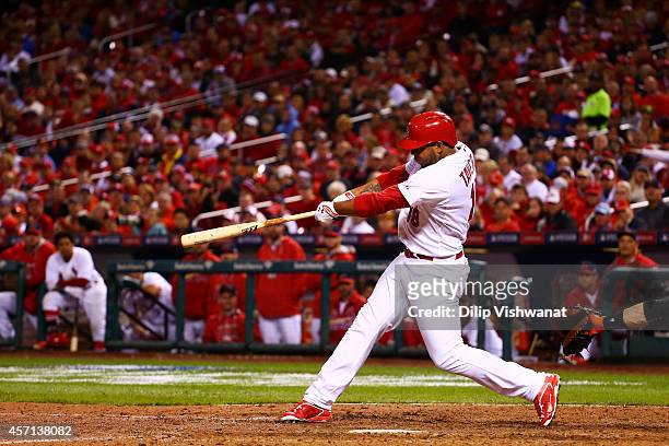 Oscar Taveras of the St. Louis Cardinals hits a solo home run in the seventh inning against the San Francisco Giants during Game Two of the National...