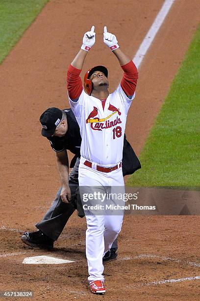 Oscar Taveras of the St. Louis Cardinals celebrates hitting a solo home run in the seventh inning against the San Francisco Giants during Game Two of...