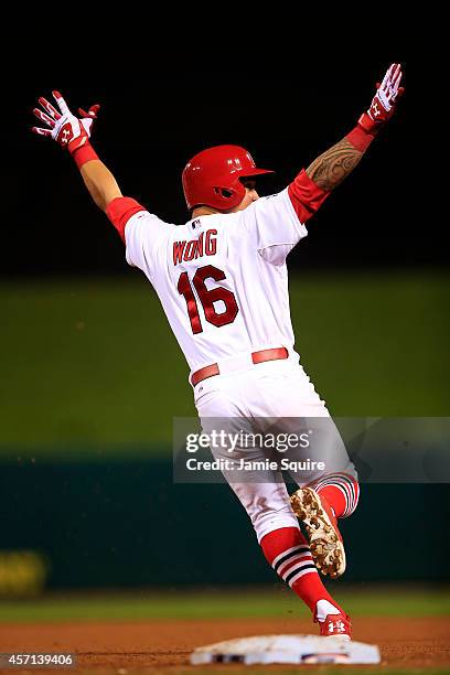 Kolten Wong of the St. Louis Cardinals celebrates his solo home run in the ninth inning to give the St. Louis Cardinals the 5 to 4 win over the San...