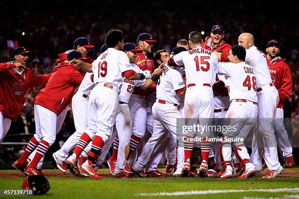 The St. Louis Cardinals celebrate their 5 to 4 win over the San Francisco Giants during Game Two of the National League Championship Series at Busch...