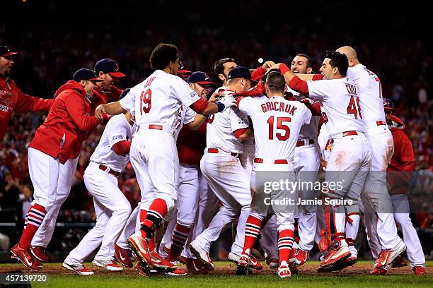 The St. Louis Cardinals celebrate their 5 to 4 win over the San Francisco Giants during Game Two of the National League Championship Series at Busch...