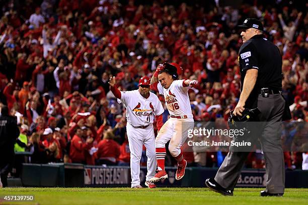 Kolten Wong of the St. Louis Cardinals celebrates his solo home run in the ninth inning to give the St. Louis Cardinals the 5 to 4 win over the San...