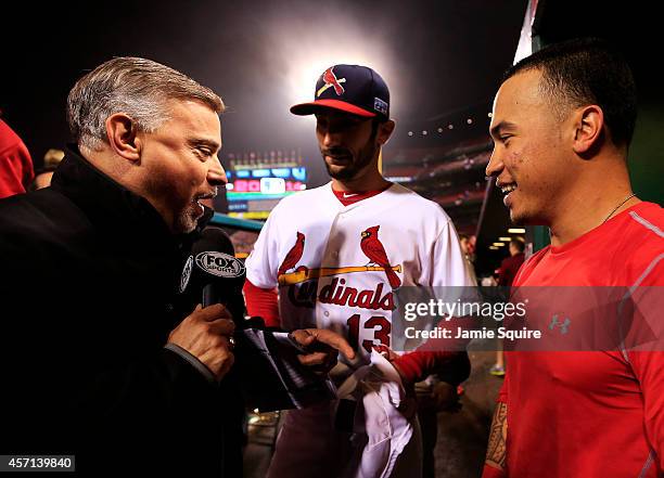 Kolten Wong and Matt Carpenter of the St. Louis Cardinals are interviewed by FOX Sports News corespondent Jim Hayes after defeating the San Francisco...