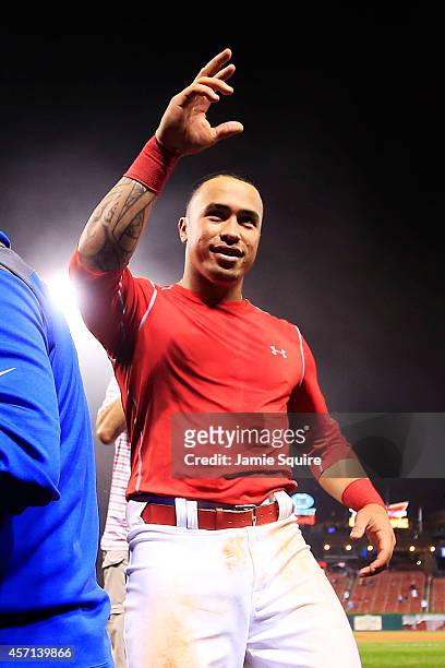 Kolten Wong of the St. Louis Cardinals waves to the crowd after his solo home run in the ninth inning gave the St. Louis Cardinals the 5 to 4 win...