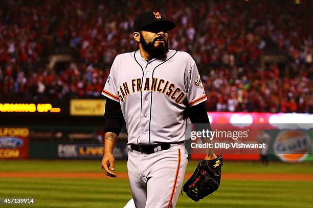 Sergio Romo of the San Francisco Giants walks to the dugout after their 5 to 4 loss to the St. Louis Cardinals in Game Two of the National League...