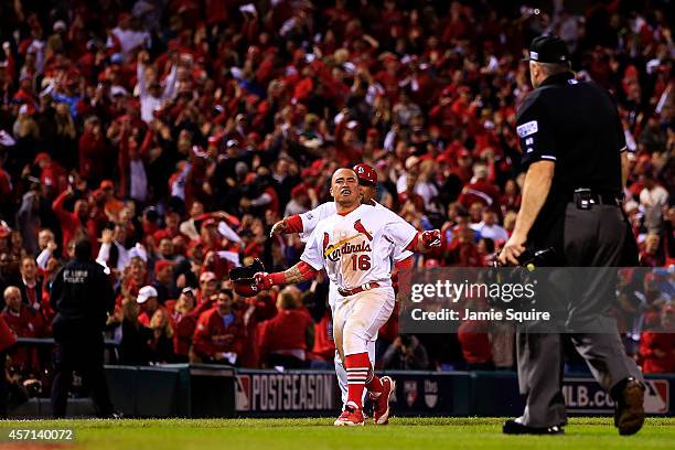 Kolten Wong of the St. Louis Cardinals celebrates his solo home run in the ninth inning to give the St. Louis Cardinals the 5 to 4 win over the San...