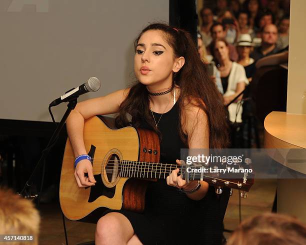 Samia Najimy Finnerty performs during a PETA event, and receives animal protection award at Sublime Restaurant on October 12, 2014 in Fort...