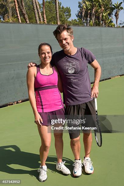 Nicole Gibbs and Timothy Olyphant attend MAK Games 2014 on October 12, 2014 in Beverly Hills, California.