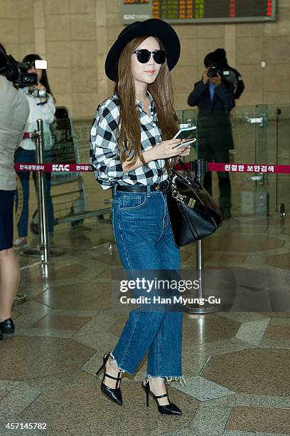 Qri of South Korean girl group T-ara is seen on departure at Gimpo International Airport on October 13, 2014 in Seoul, South Korea.