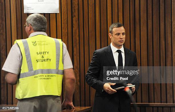 Oscar Pistorius arrives in the Pretoria High Court for sentencing in his murder trial on October 13 in Pretoria, South Africa. Judge Thokozile Masipa...