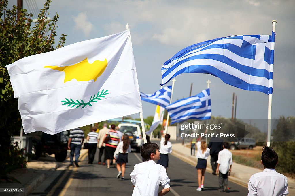 Young students holding Cyprus and Greece Flags on their way...