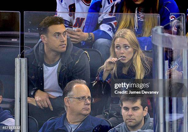 Adam Cobb and AnnaSophia Robb attend New York Rangers vs Toronto Maple Leafs game at Madison Square Garden on October 12, 2014 in New York City.