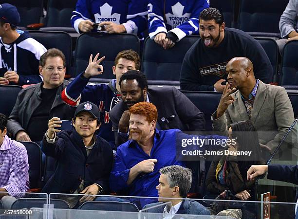 Steven Yeun, Chad Coleman and Michael Cudlitz attend New York Rangers vs Toronto Maple Leafs game at Madison Square Garden on October 12, 2014 in New...