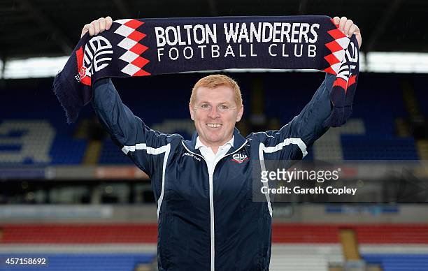 Neil Lennon poses for a photographers after a press conference where he was unveiled as the new Bolton Wanderers manager at the Macron Stadium on...