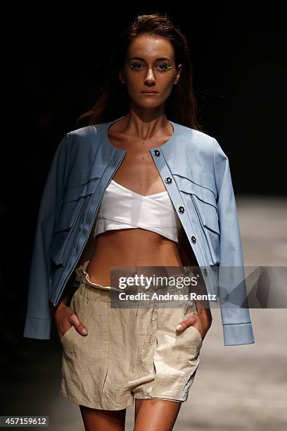 Model walks the runway at the Asli Guler show during Mercedes Benz Fashion Week Istanbul SS15 at Antrepo 3 on October 13, 2014 in Istanbul, Turkey.