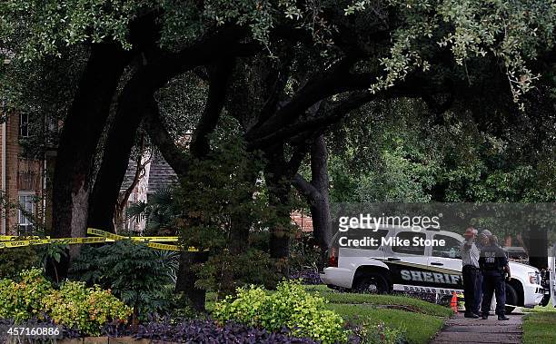 Dallas sheriffs and hazmat workers wait outside of an apartment where a second person diagnosed with the Ebola virus resides on October 13, 2014 in...