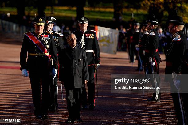 King Harald V of Norway and the President of India Pranab Mukherjee review a military honour guard during an official welcoming ceremony during the...