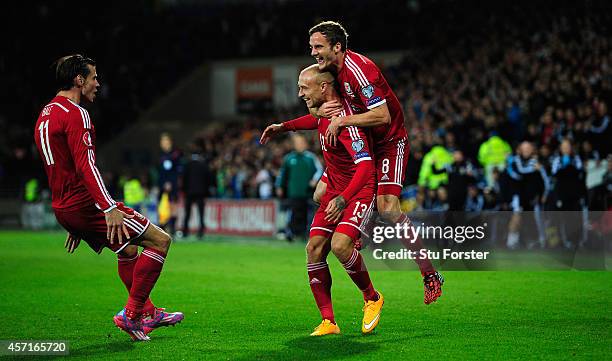 Wales player David Cotterill celebrates his opening goal with Gareth Bale and Andy King during the EURO 2016 Qualifier match between Wales and Cyprus...