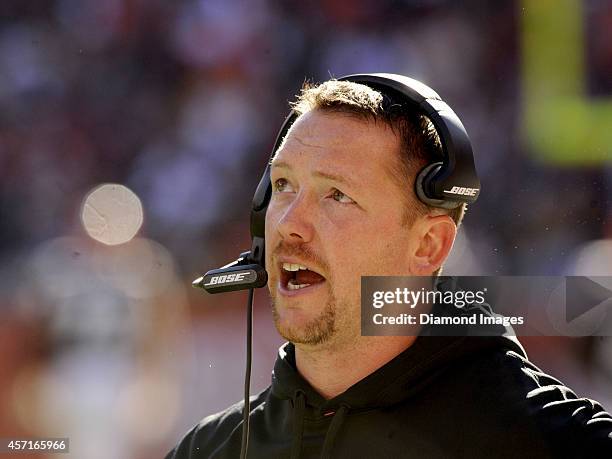 Defensive coordinator Jim O'Neil of the Cleveland Browns talks into his headset during a game against the Pittsburgh Steelers on October 12, 2014 at...