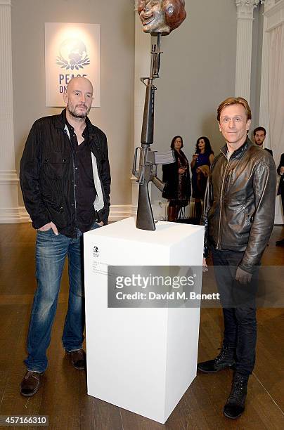 Jake Chapman and Jeremy Gilley attend the M16 Private View curated by Jake Chapman in support of Peace One Day at the Institute Of Contemporary Arts...