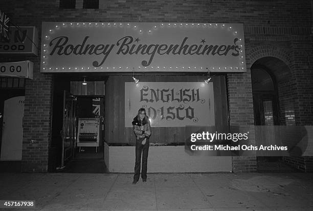 Nightclub owner Rodney Bingenheimer stands outside his English Disco located at 7561 Sunset Boulevard on the Sunset Strip circa 1974 in Los Angeles,...