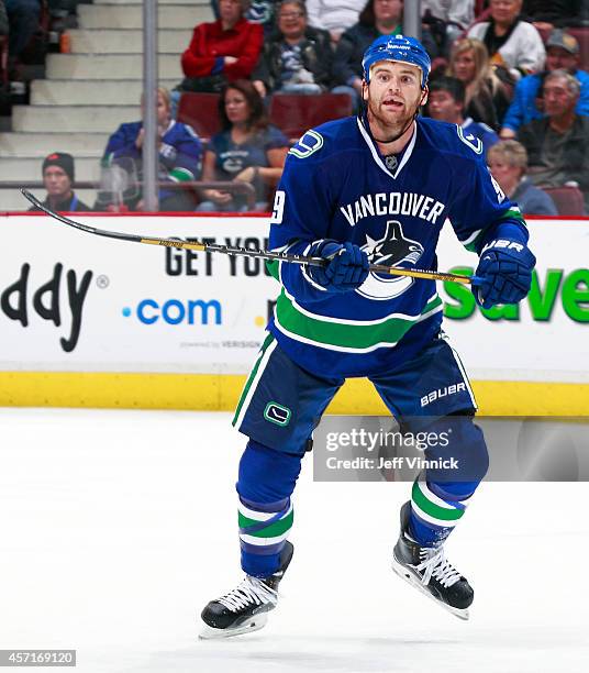 Zack Kassian of the Vancouver Canucks skates up ice during their NHL game against the Edmonton Oilers at Rogers Arena October 11, 2014 in Vancouver,...