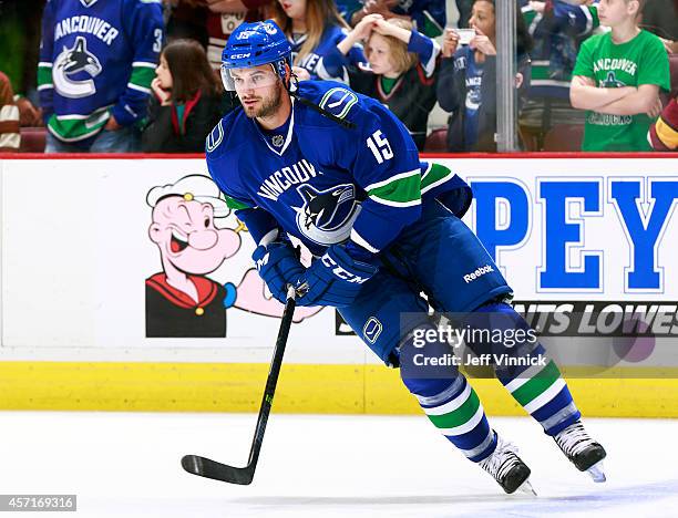 Brad Richardson of the Vancouver Canucks skates up ice during their NHL game against the Edmonton Oilers at Rogers Arena October 11, 2014 in...