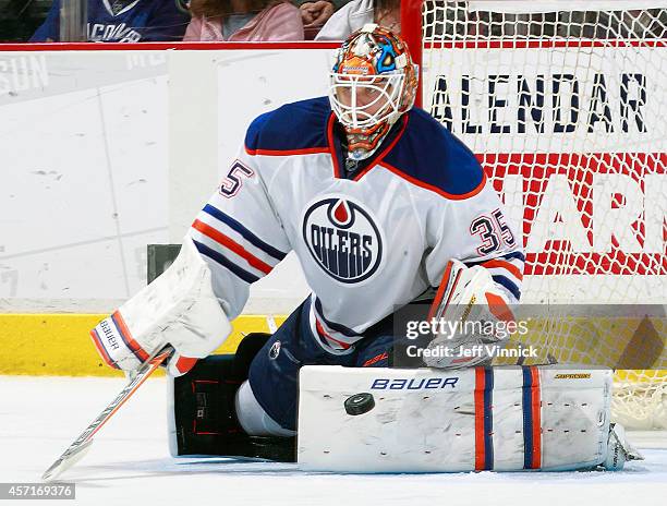 Viktor Fasth of the Edmonton Oilers makes a save during their NHL game against the Vancouver Canucks at Rogers Arena October 11, 2014 in Vancouver,...