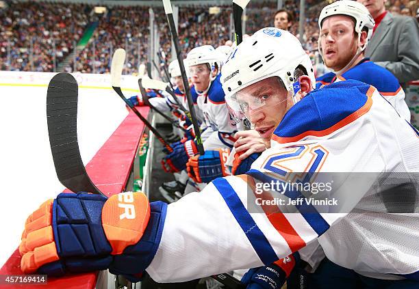 Andrew Ference of the Edmonton Oilers looks on from the bench during their NHL game against the Vancouver Canucks at Rogers Arena October 11, 2014 in...