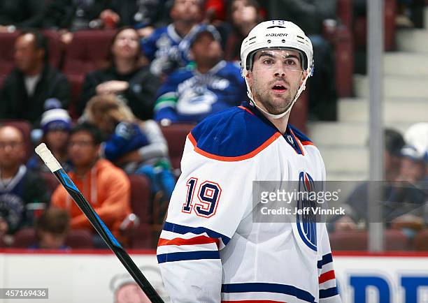 Justin Schultz of the Edmonton Oilers looks to the bench during their NHL game against the Vancouver Canucks at Rogers Arena October 11, 2014 in...