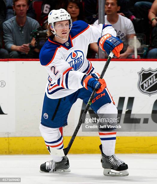 Jeff Petry of the Edmonton Oilers passes the puck up ice during their NHL game against the Vancouver Canucks at Rogers Arena October 11, 2014 in...