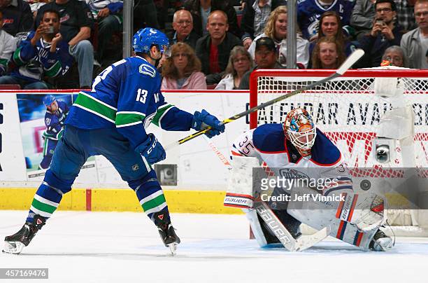Viktor Fasth of the Edmonton Oilers makes a save off the shot of Nick Bonino of the Vancouver Canucks during their NHL game at Rogers Arena October...