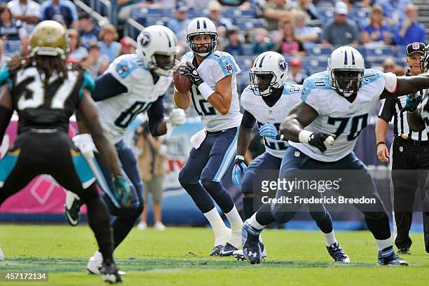 Charlie Whitehurst of the Tennessee Titans drop back to throw a pass behind Chance Warmack during a game against the Jacksonville Jaguars at LP Field...