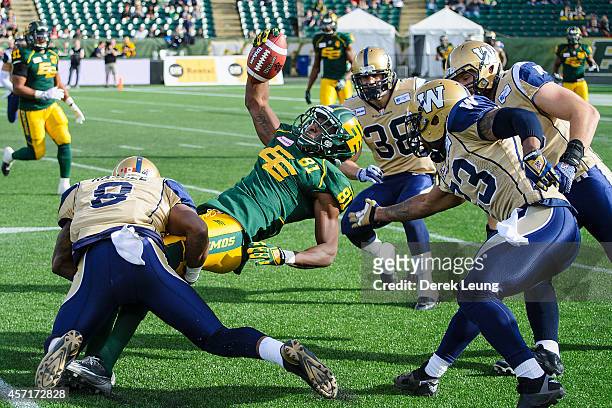 Devon Bailey of the Edmonton Eskimos makes a pass reception during a CFL game against the Winnipeg Blue Bombers at Commonwealth Stadium on October...