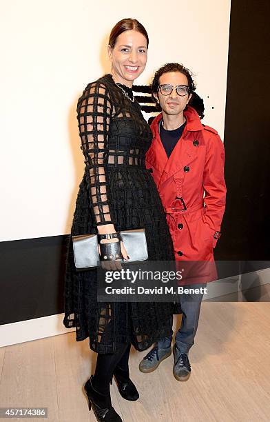 Imran Amed and guest attend the launch party for Phillips European Headquarters at 30 Berkeley Square on October 13, 2014 in London, England.