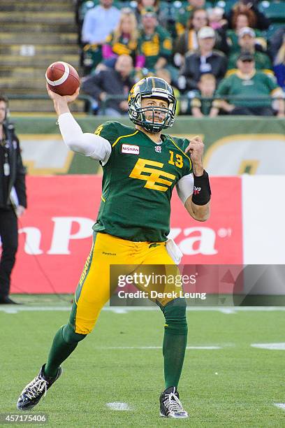 Mike Reilly of the Edmonton Eskimos makes a pass against the Winnipeg Blue Bombers during a CFL game at Commonwealth Stadium on October 13, 2014 in...